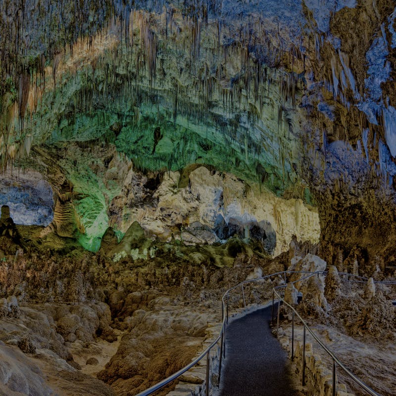 Green and blue lights inside Carlsbad Caverns National Park