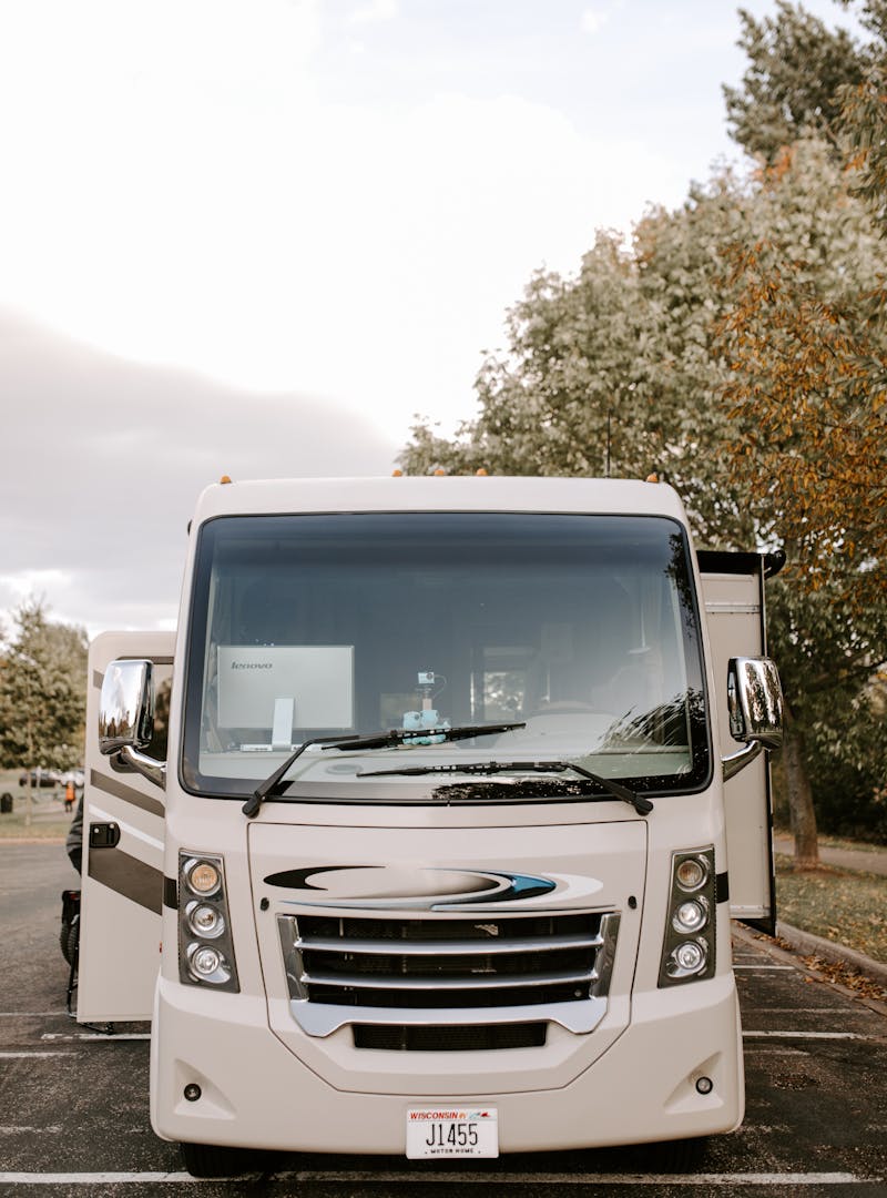 A front shot of a Class A RV with its slides out.