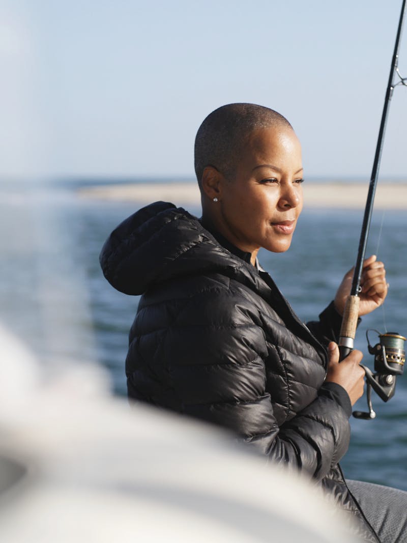 Sonya Lowery holding a fishing pole on a deep sea fishing trip in Cape Cod.