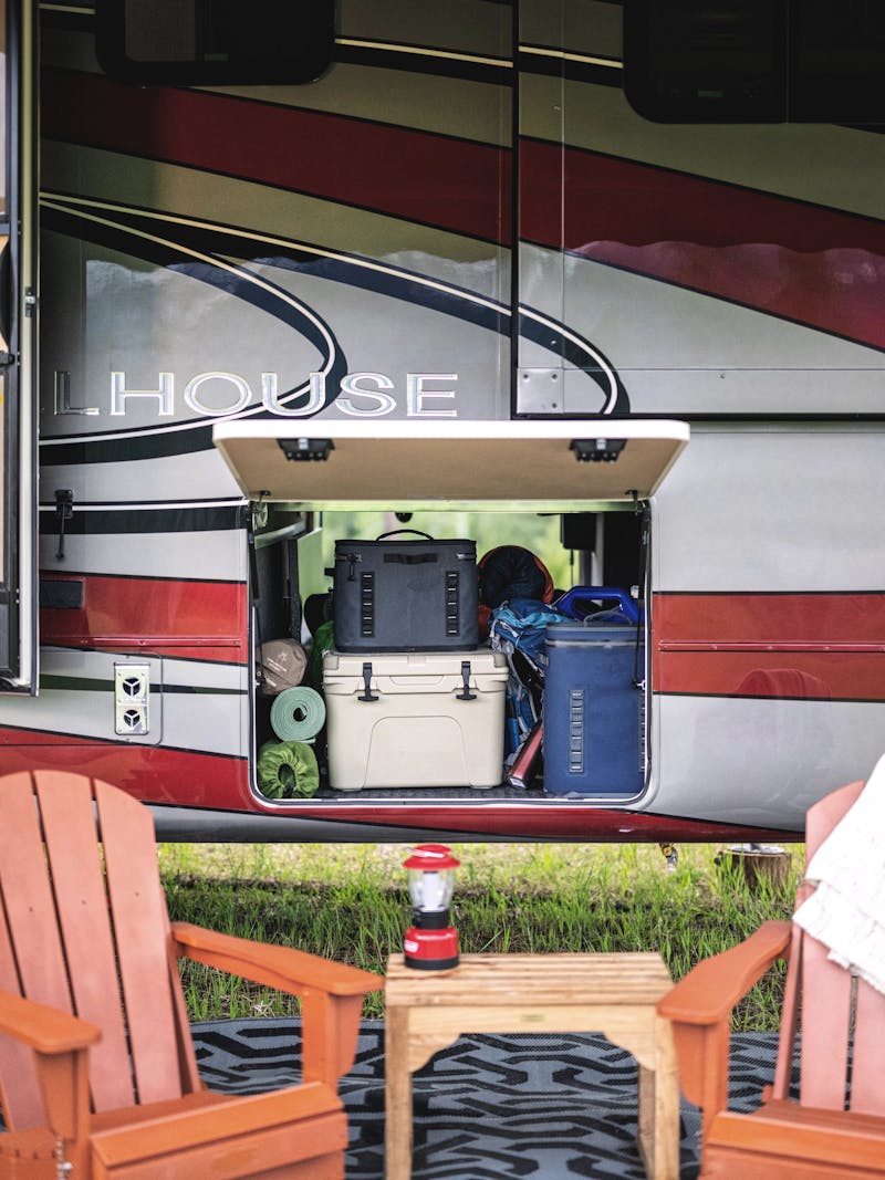 Camping gear in an garage storage compartment