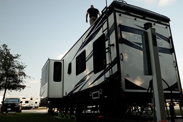 Andy Murphy on top of his stationary RV