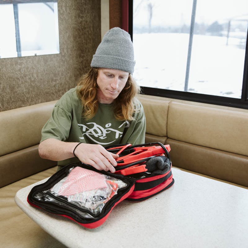 Packing up tools and gear for winter camping.
