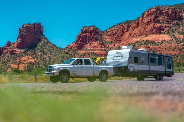 Renee Tilby's Jayco travel trailer being driven down the road in coconino national forest