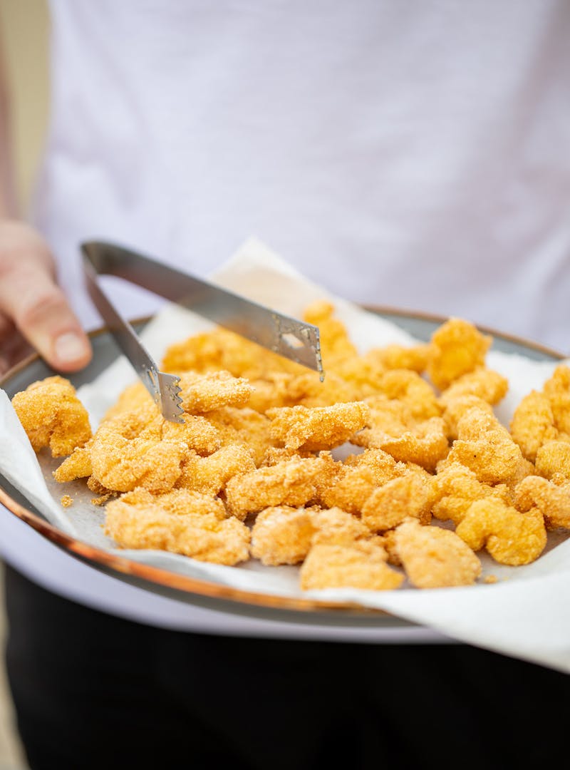 A platter of golden fried shrimp.