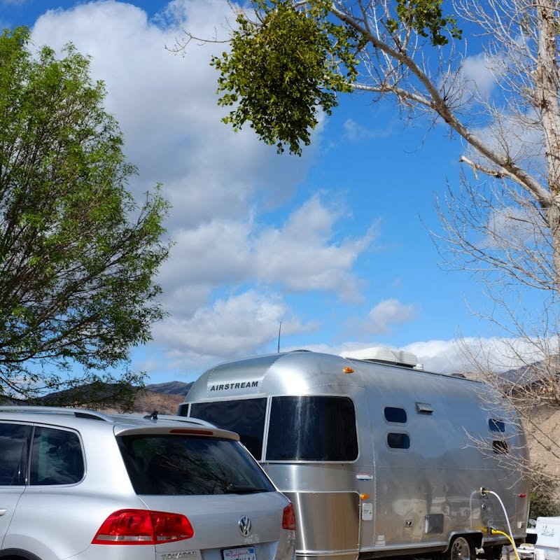 Dr. Na's Airstream parked at a campsite.