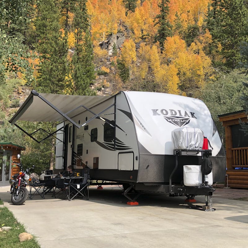 Abby Booth's Kodiak travel trailer parked at a campsite.