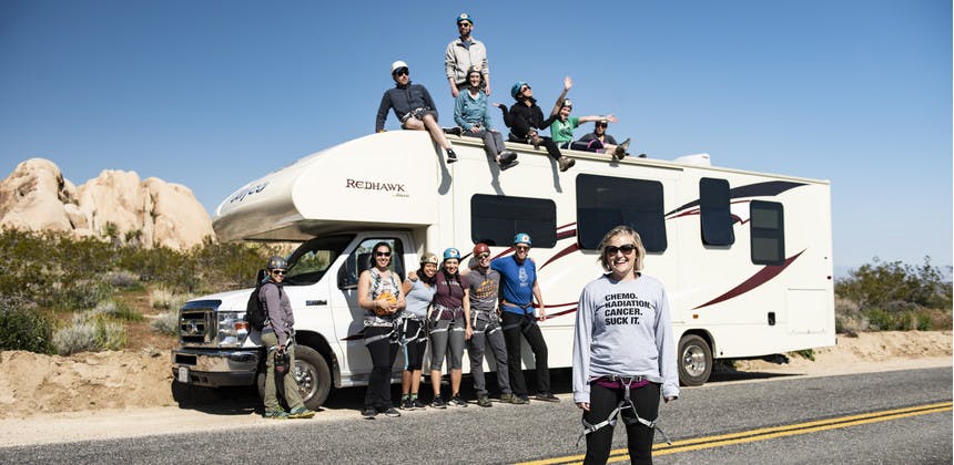 First Descents cancer young adult group in front of Jayco Redhawk RV in Joshua Tree