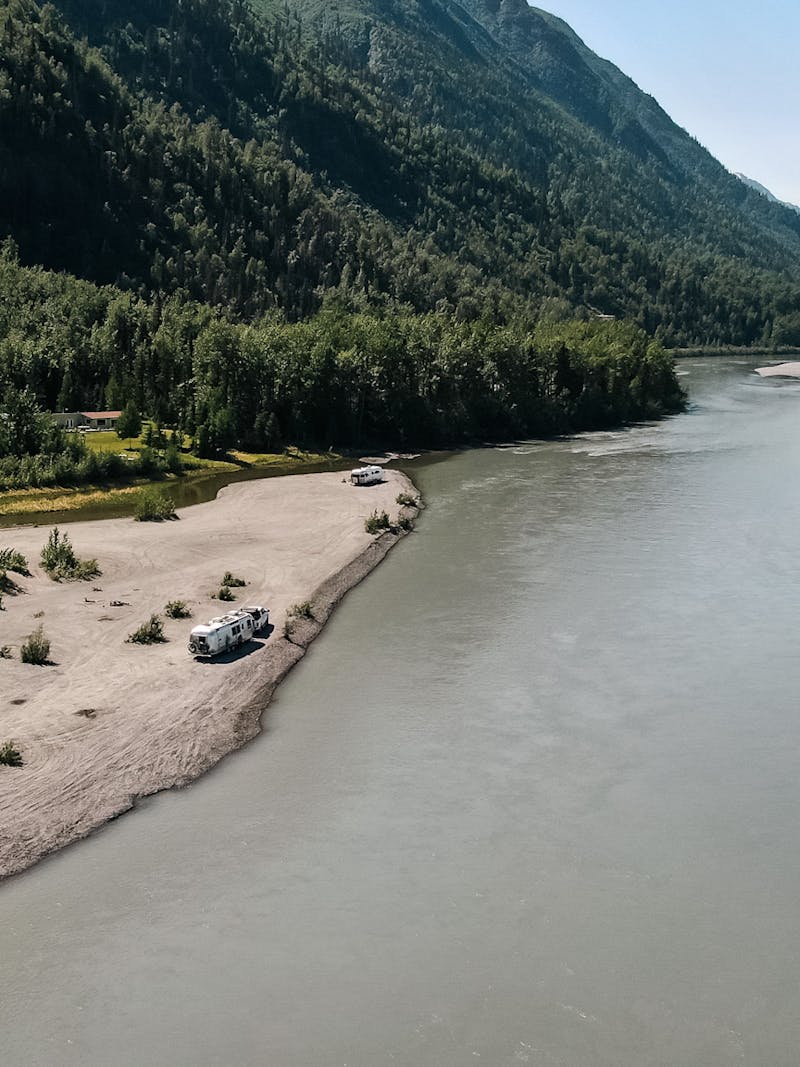 An aerial view of Karen Blue's RV parked alongside a lake 
