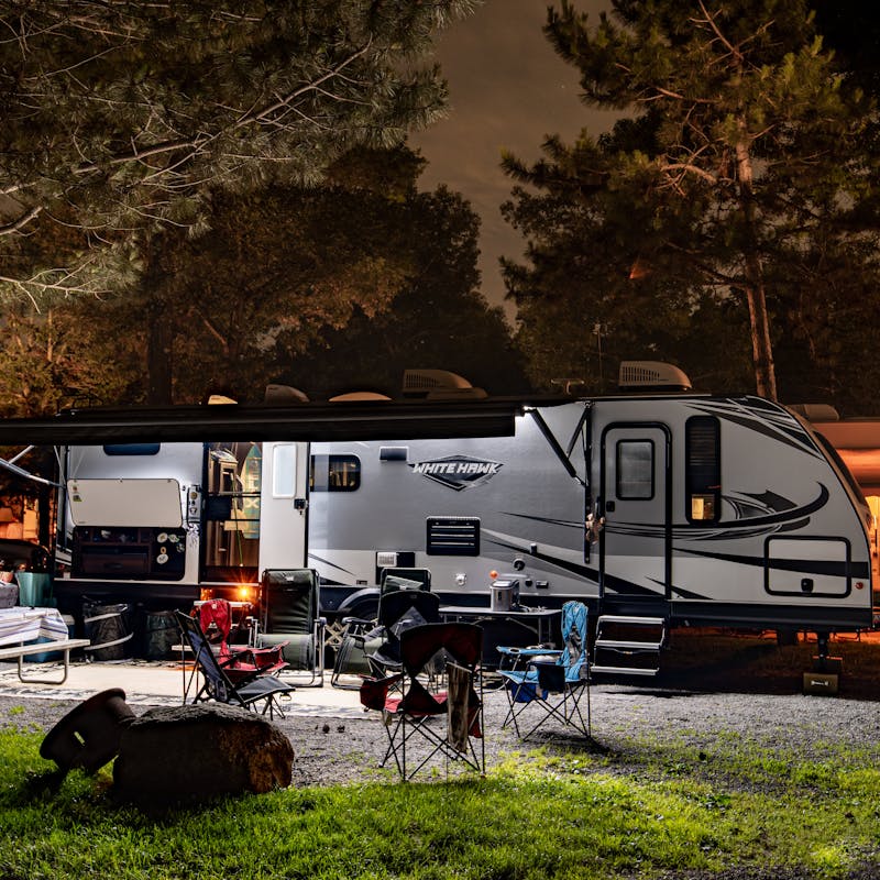 Bill Sferrazza's Jayco RV parked at night at a campsite.