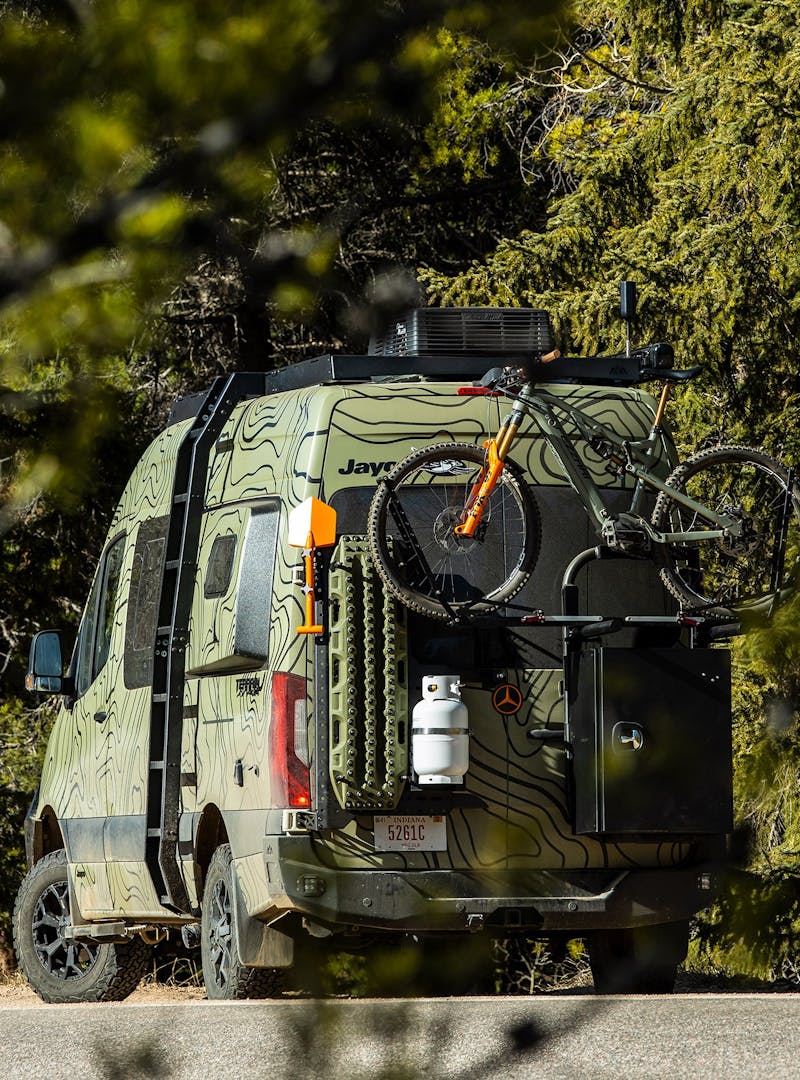 A bike strapped on a bike rack on Mike's Jayco Terrain