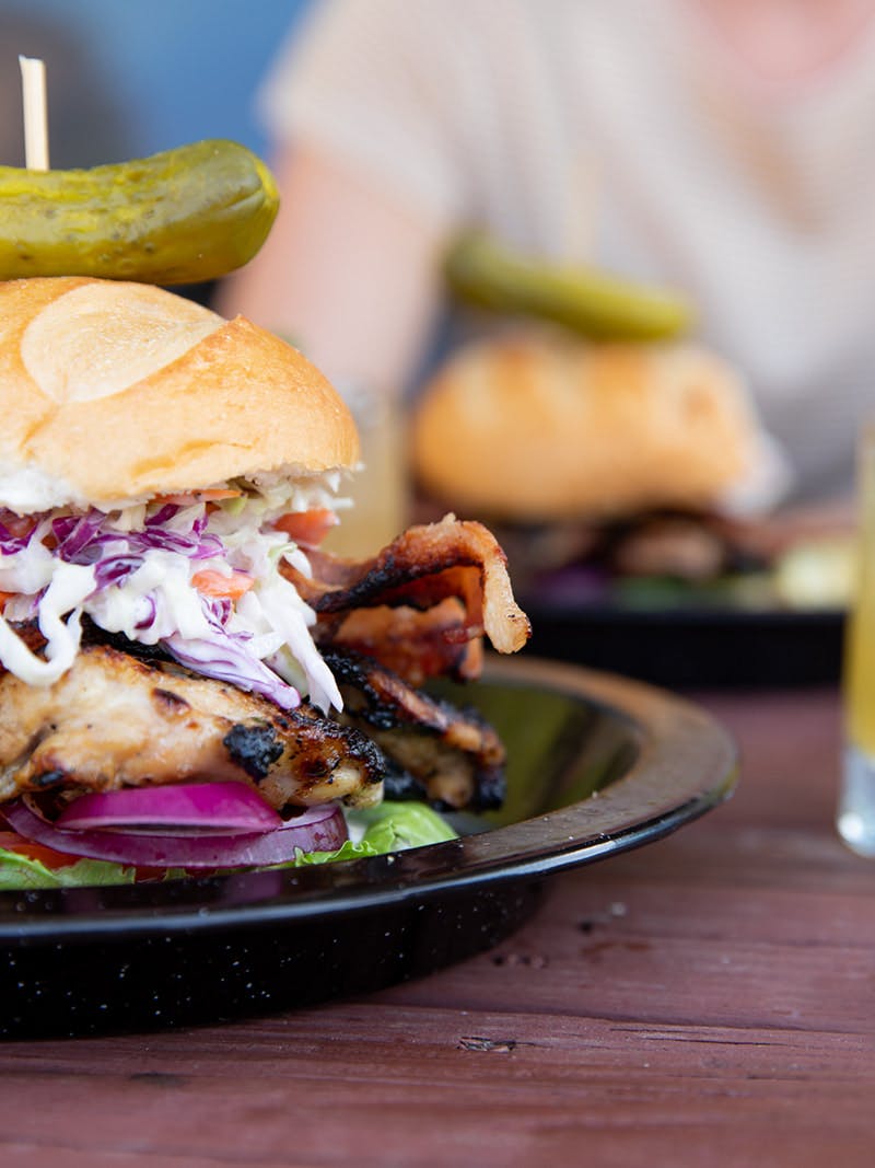 A close up shot of a BBQ chicken sandwich.