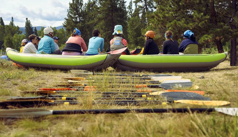 Participants sit during a training on how to kayak.