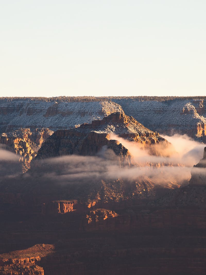 Sunset view of the Grand Canyon with clouds through the rocks