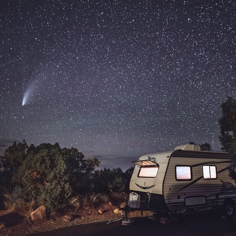 the NEOWISE comet flashes through the sky with Alison Takacs's Jayco RV in the foreground.