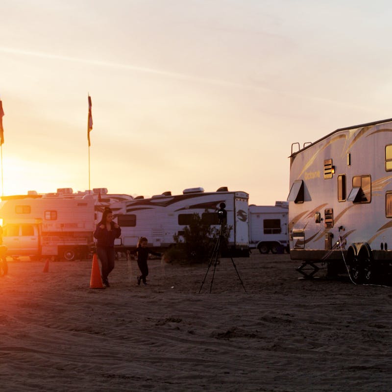 The sun setting over RVs parked at Glamis.