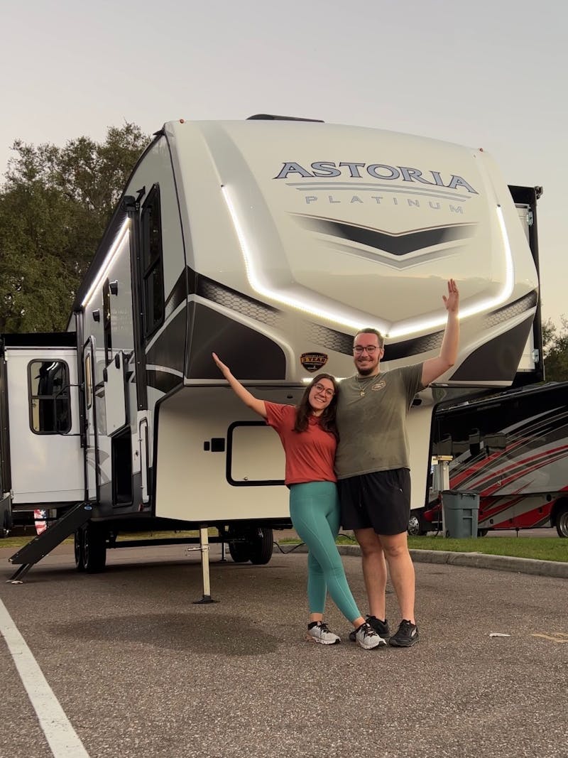 Bailey and Nicole Damberg in front of their Astoria Fifth Wheel 