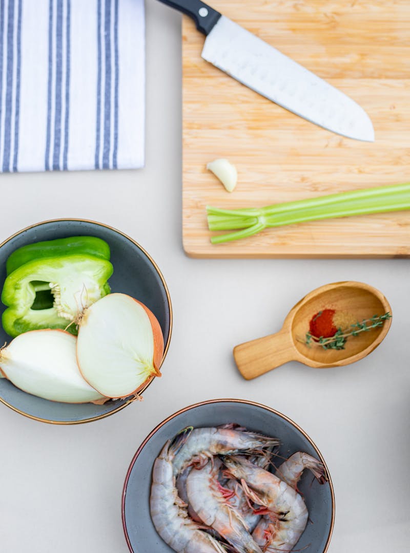 Prepping onion, green pepper, celery and shrimp for the recipe.
