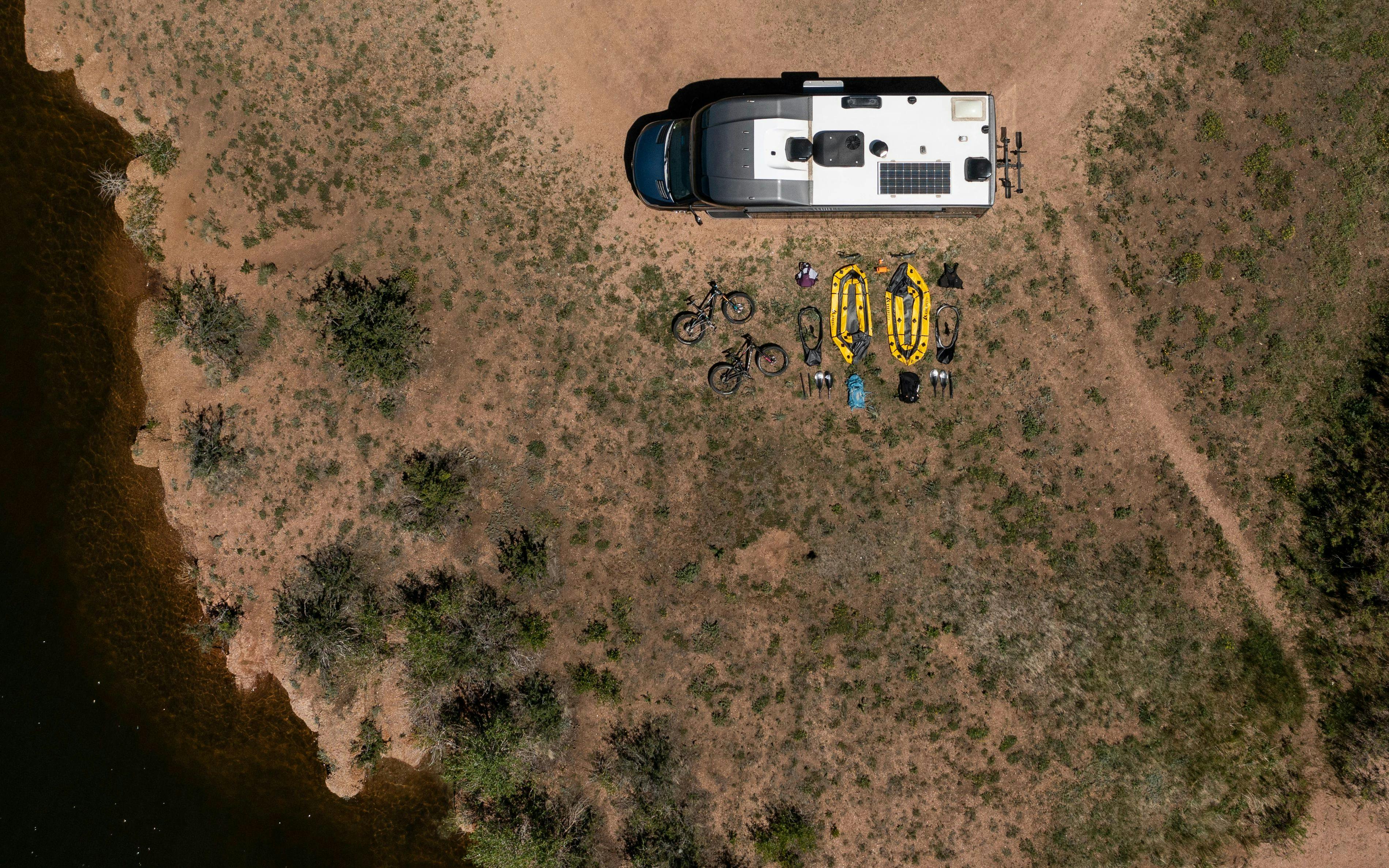 a top down view of dustin and sarah bauer's packrafting gear spread out on the ground