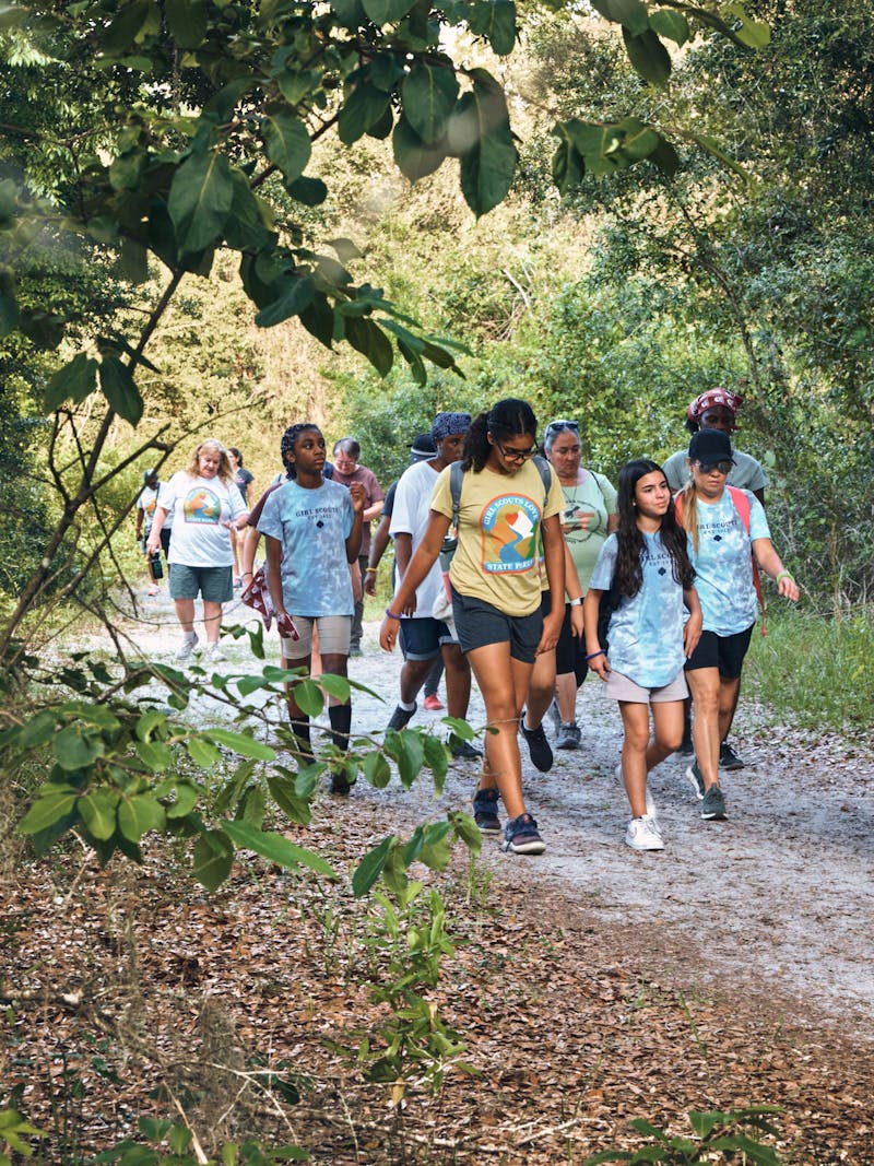 Girl Scouts walking on a nature trail