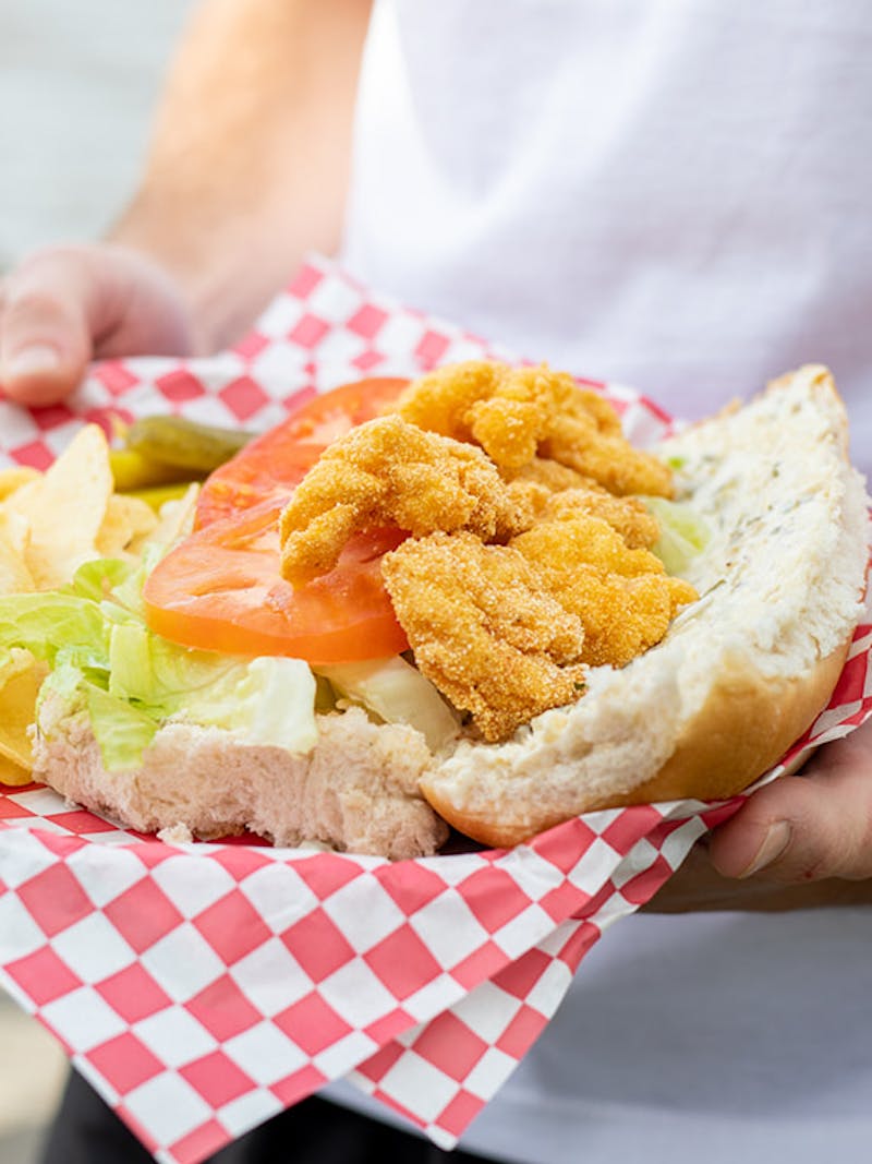 Crispy fried shrimp on a french roll with remoulade, tomatoes and lettuce.  