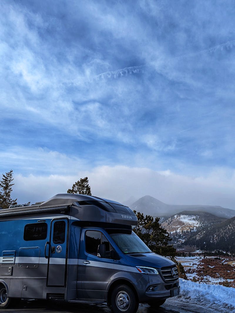 Dustin and Sarah Bauer's RV parked near snowy mountains
