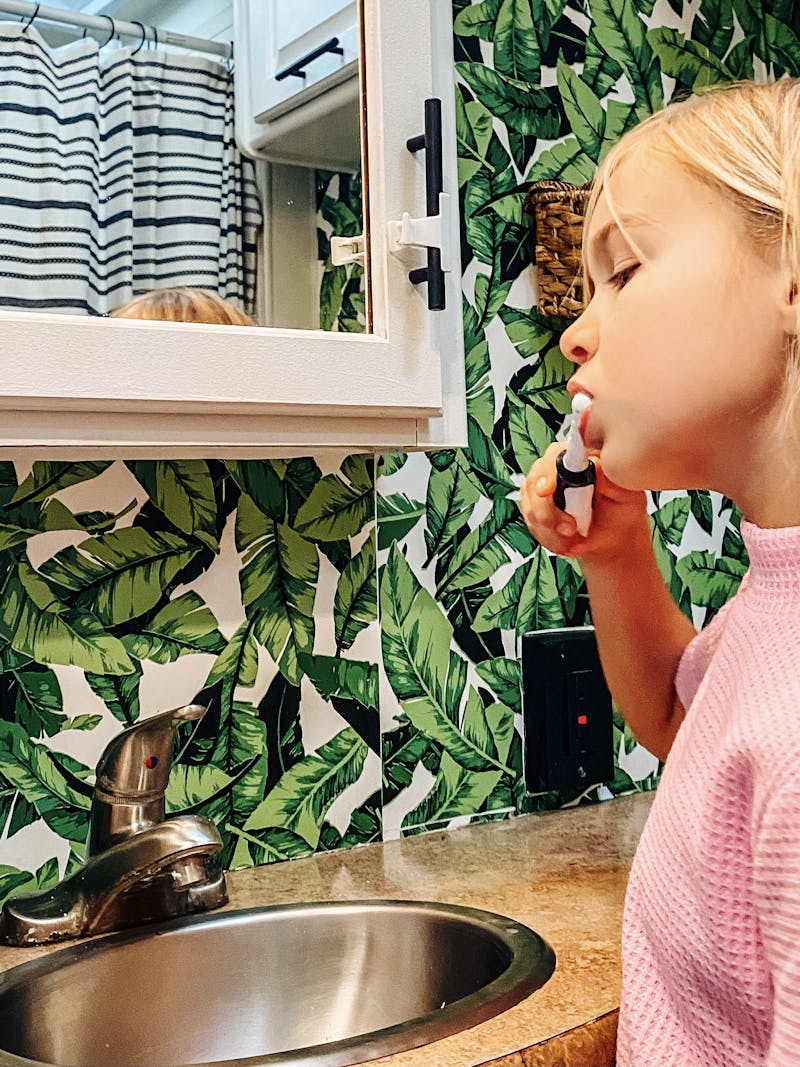 Justin and Michelle Russell's daughter brushing her teeth