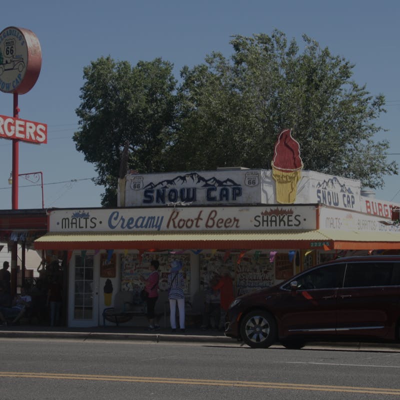 Delgadillos Snow Cap Drive-In restaurant with red van in front