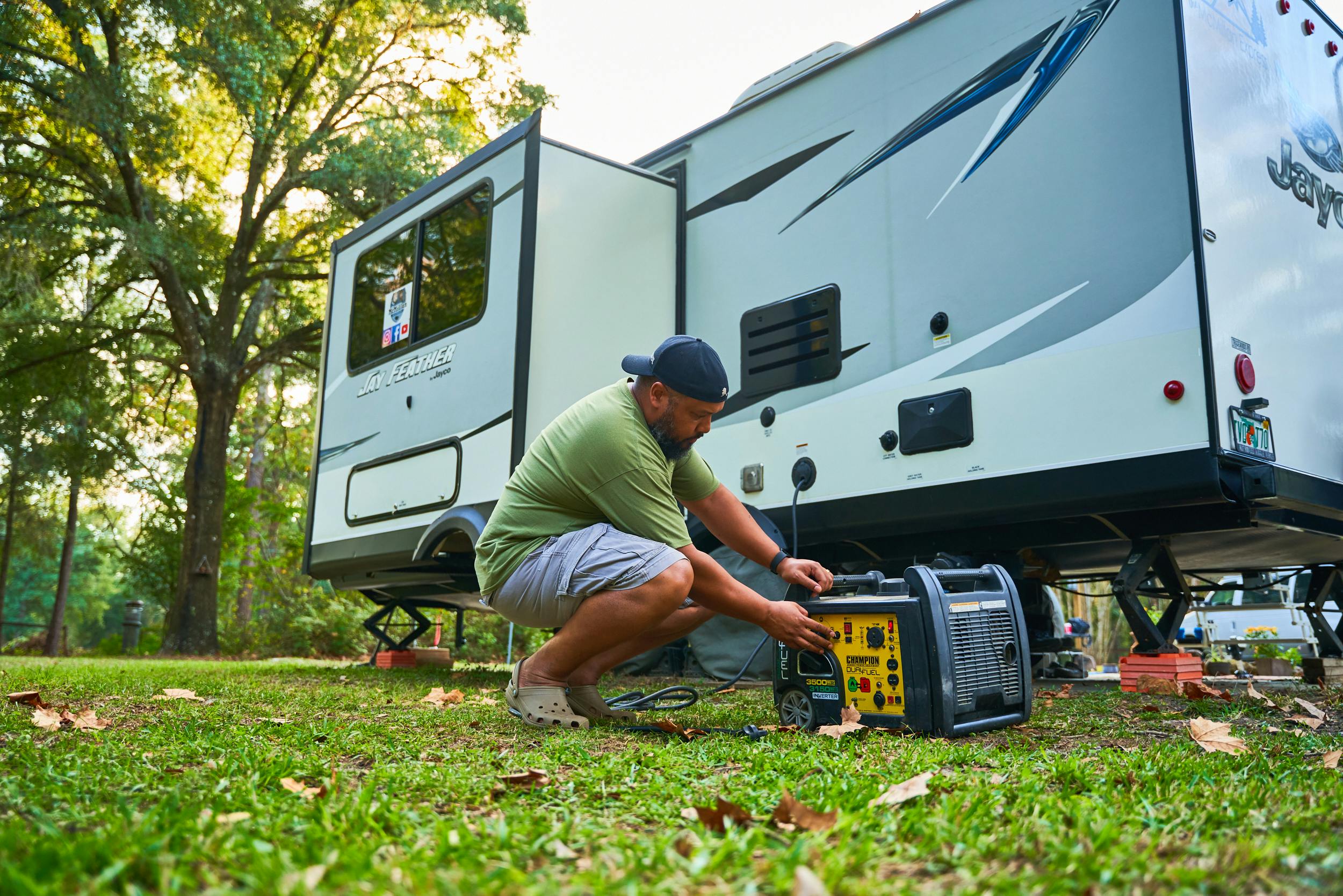 Ben McMillan working with a generator outside of his RV