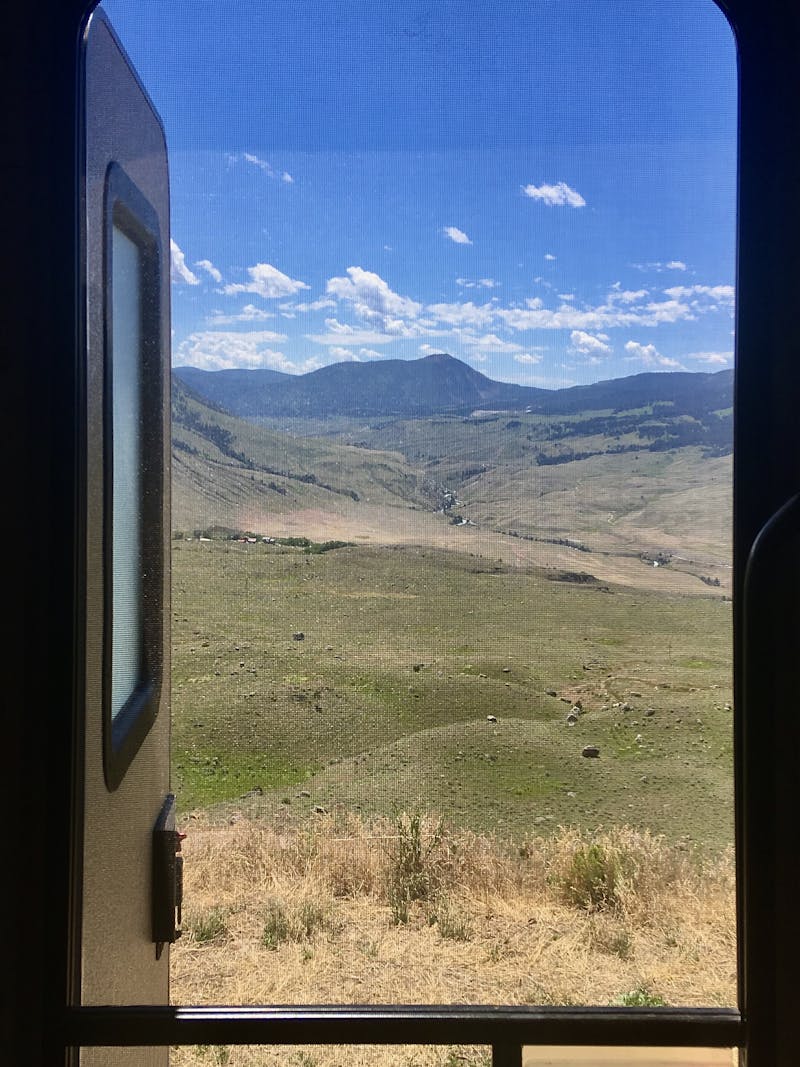 A view out an RV window to Yellowstone National Park. 