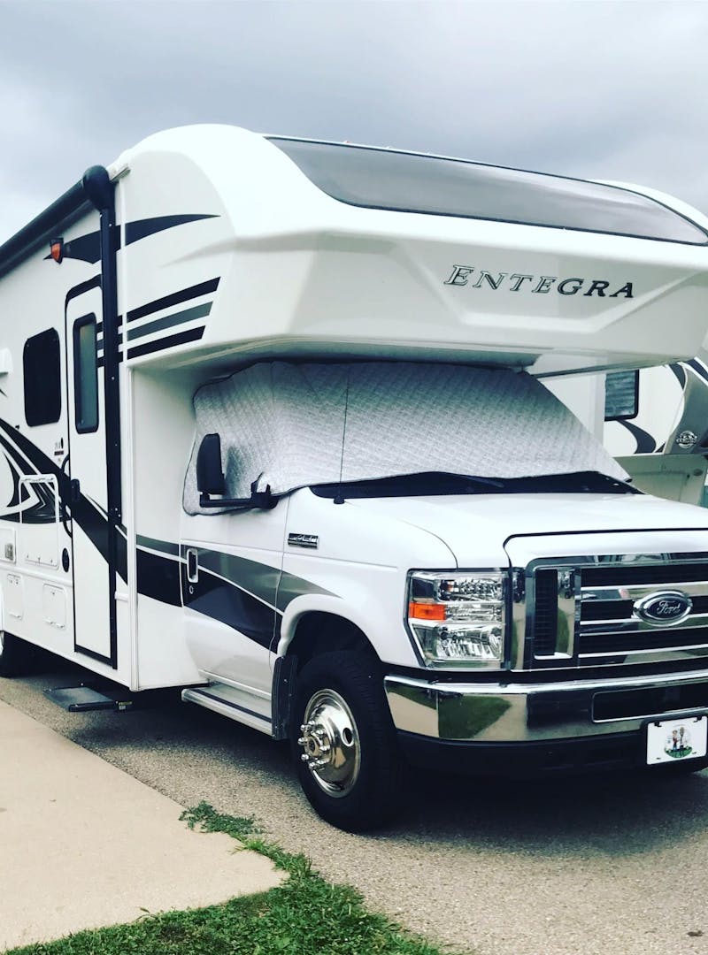 Kirsten and Mack Womack's Entegra Class C RV parked at an RV park.