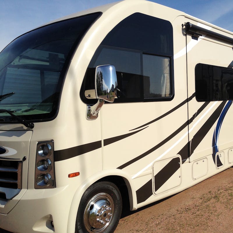 A side shot of a brand new RV.
