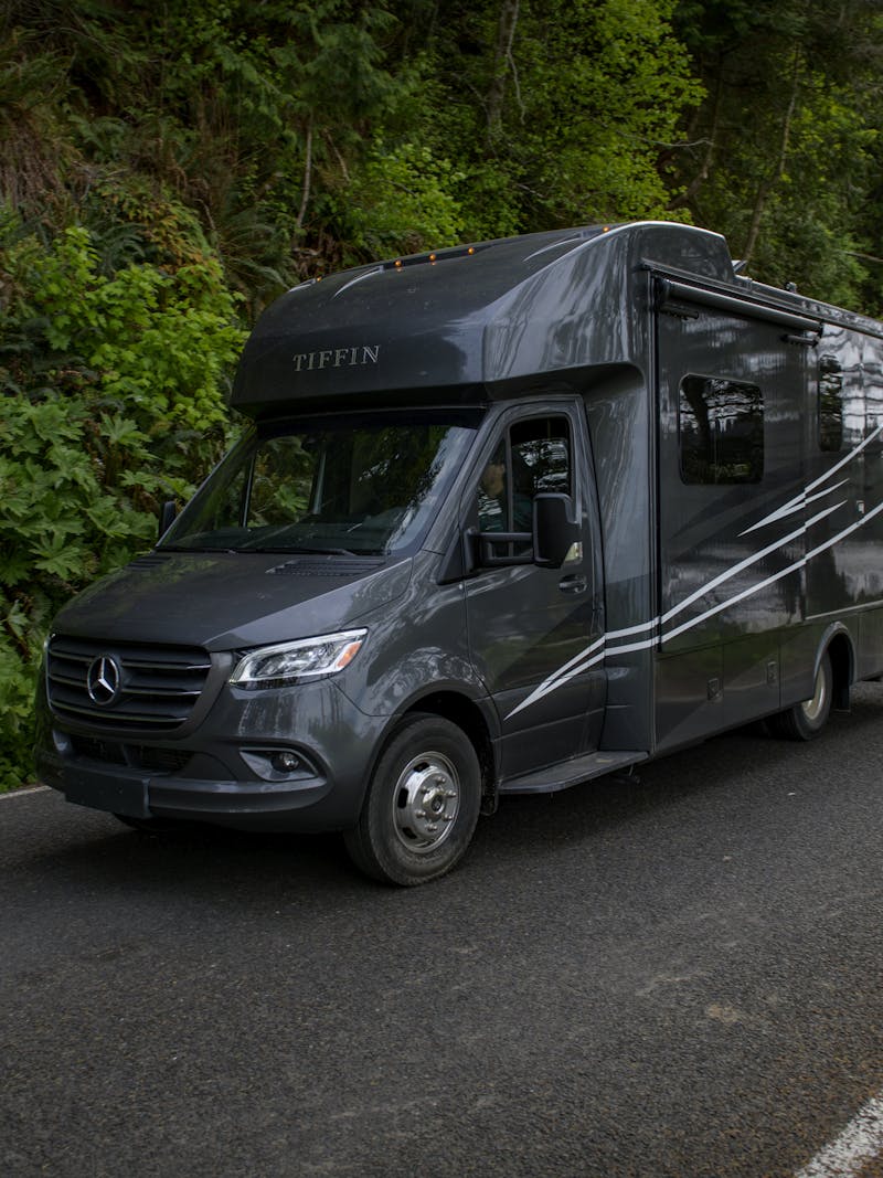 Chelsea and Layla driving down the road in a Tiffin Wayfarer RV