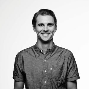A headshot of Marshall Miller against a white background.