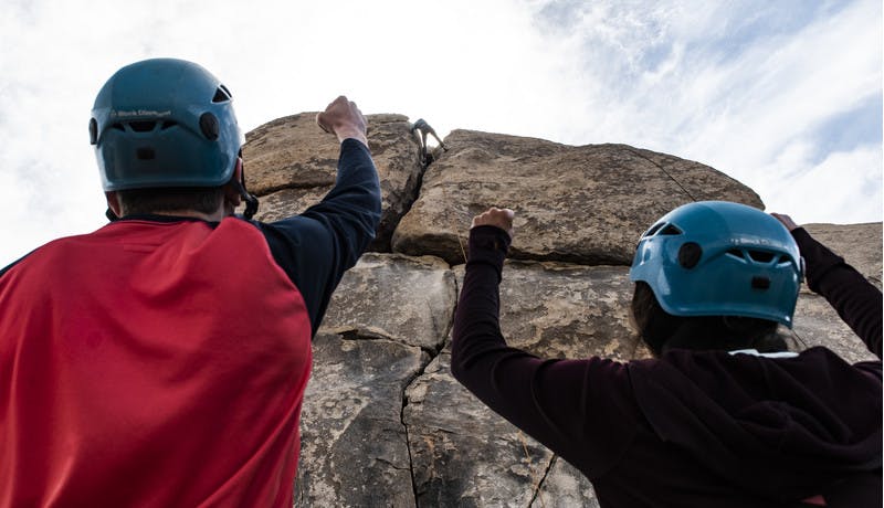 Participants cheer each other on as one climber reached the top of the rocks.