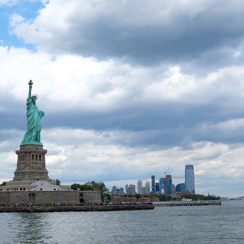 A shot of the statue of liberty from the water.