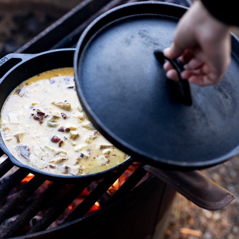 What is the benefit of putting a lid on top of a pan when cooking