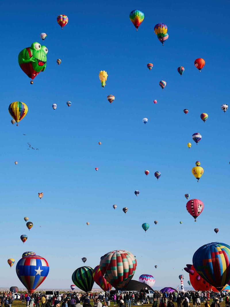 A sky full of colorful hot air balloons at the Albuquerque Balloon Fiesta