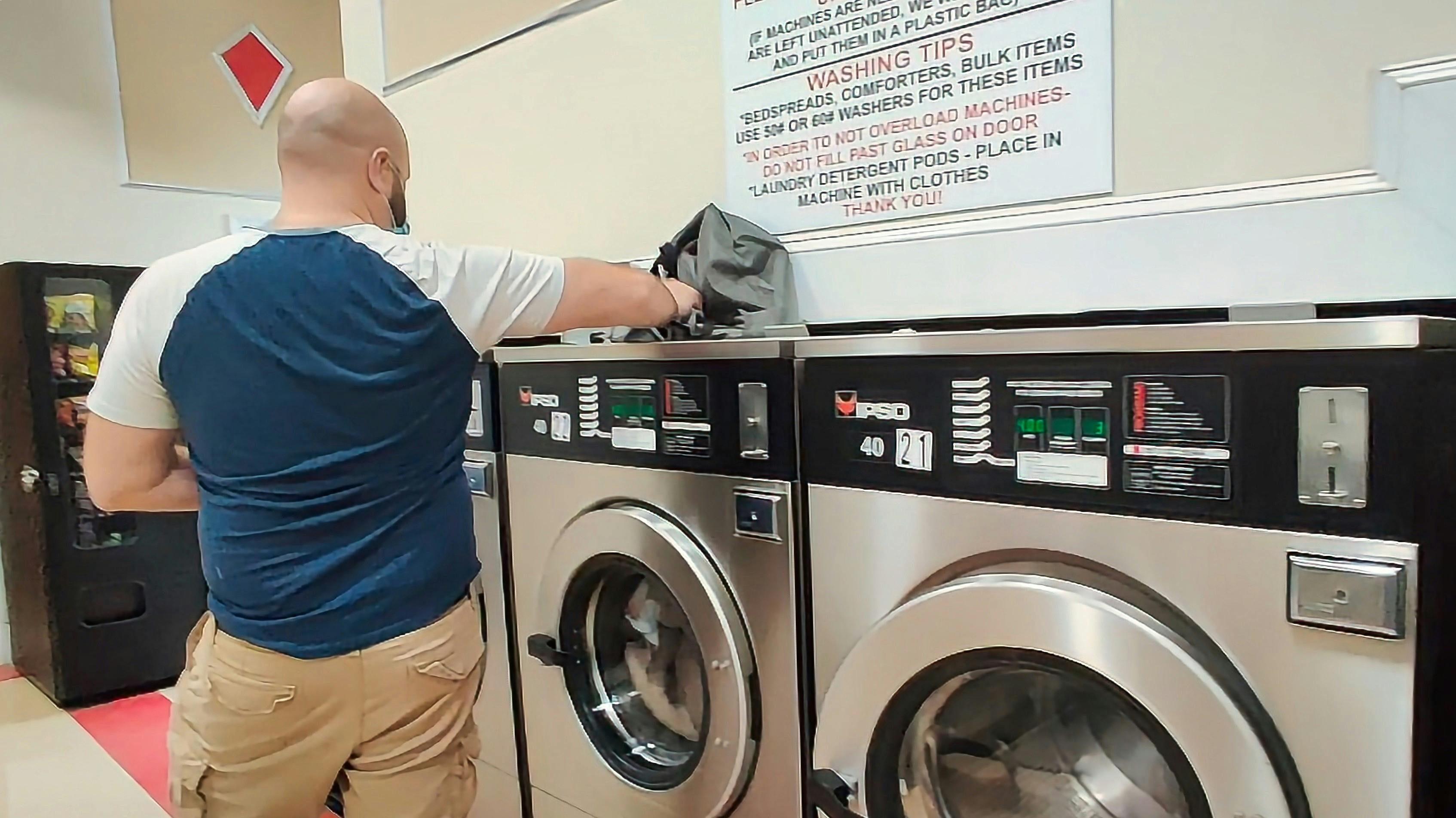 Gabe Rivero doing laundry at a laundromat 