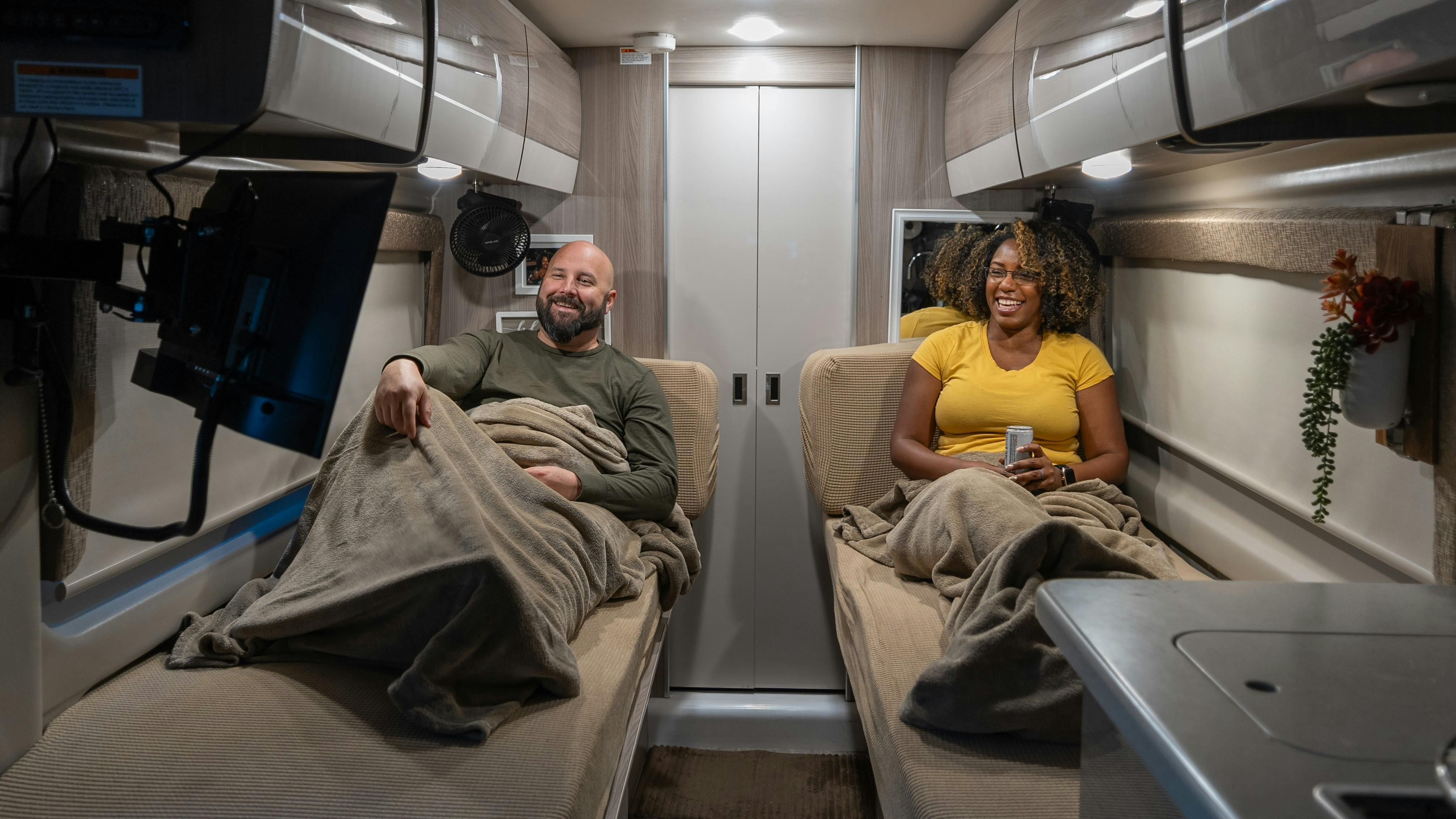 A TV on a swivel-mount and built-in Wi-Fi makes movies in bed easy inside Gabe and Rocio Rivero's Thor Motor Coach Sequence.