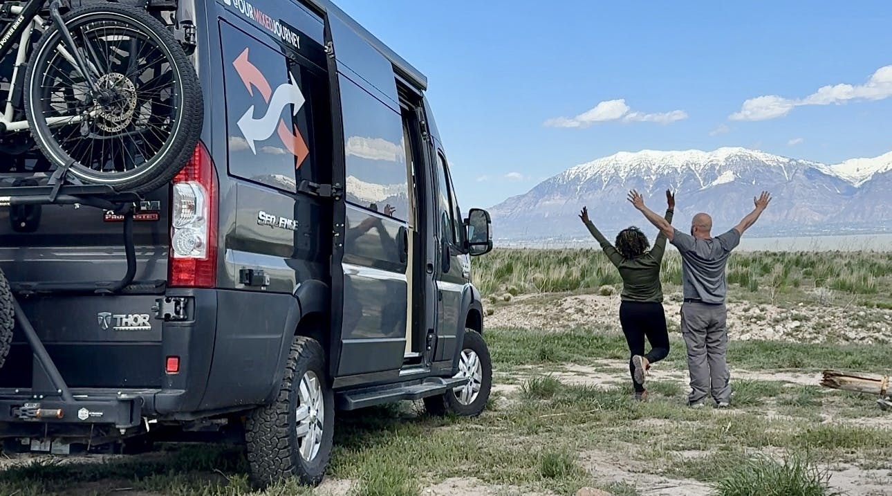 Gabe and Rocio Rivero next to their Thor Motor Coach Sequence in the mountains.