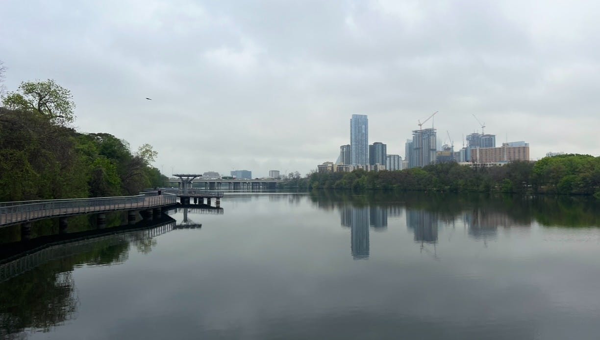 A photo of the Austin, Texas city skyline, along the river. Taken by Bailey and Nicole Damberg.