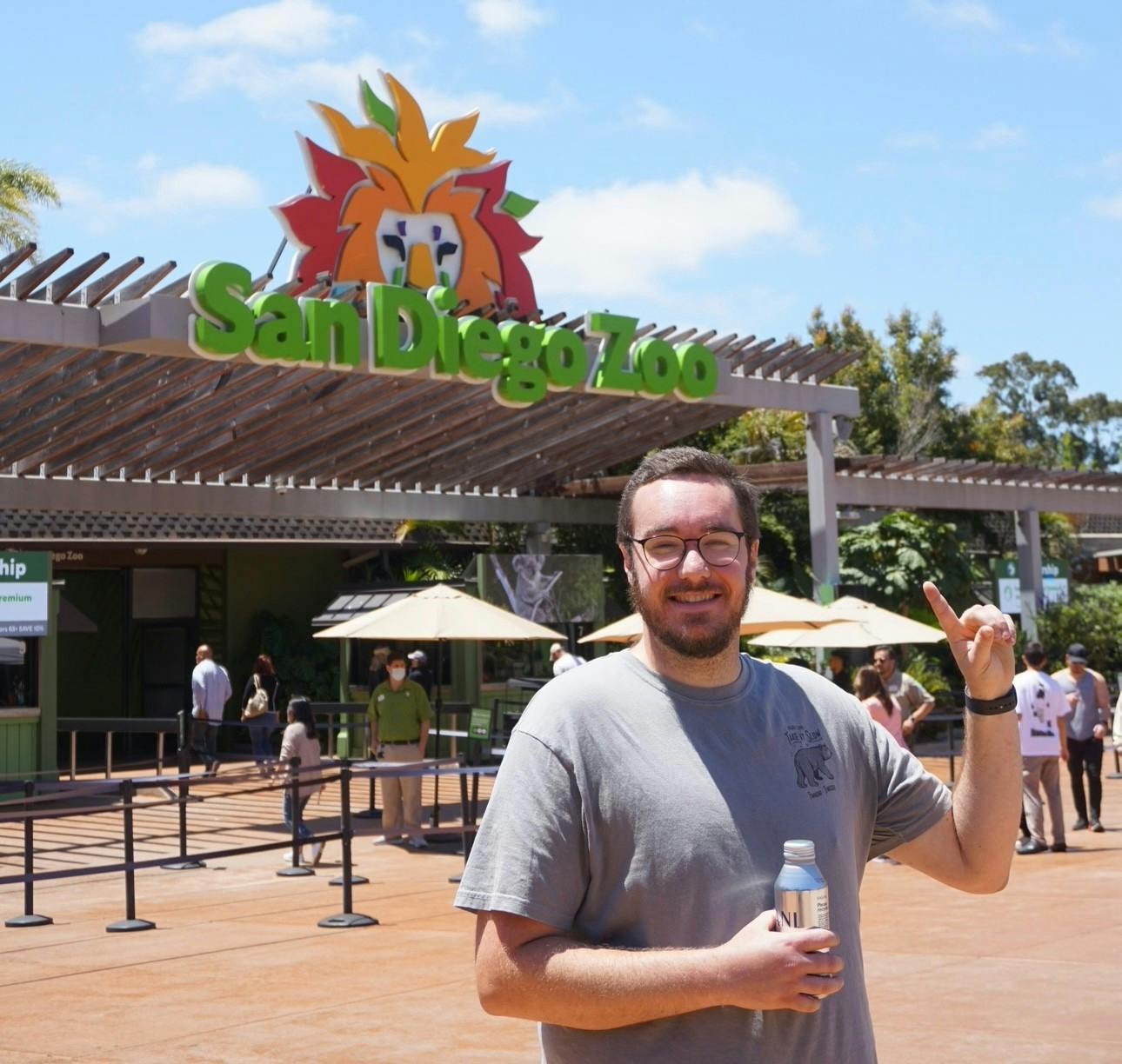 Bailey Damberg next to the San Diego Zoo sign.