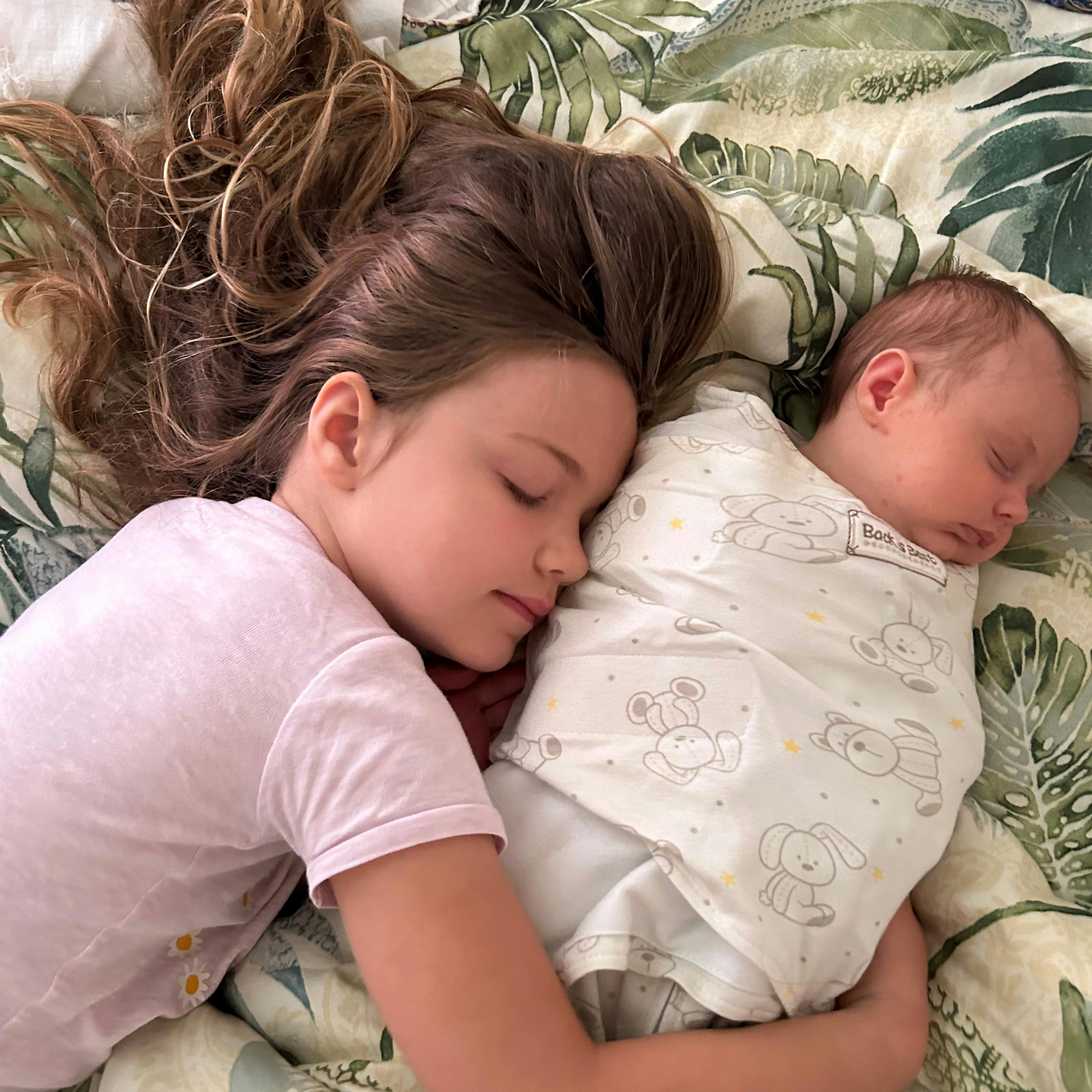 John King's daughters sleeping in their Cruiser MPG travel trailer.