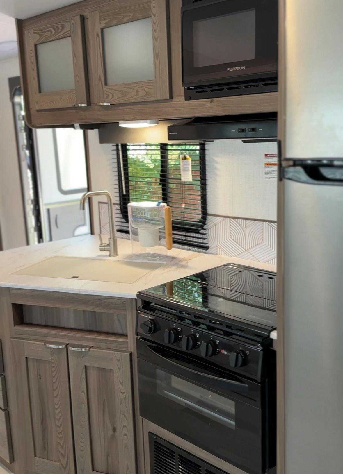 The kitchen inside John King's Cruiser MPG travel trailer.