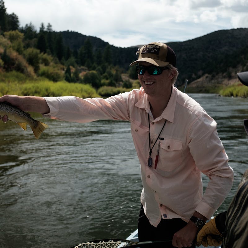 Marshall posed with a fish in his hand, as though he just plucked it from the water.