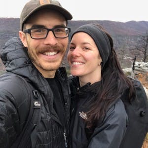 Jonathan Moore and Aubrey Janelle dressed in winter jackets taking a selfie, smiling at the camera.