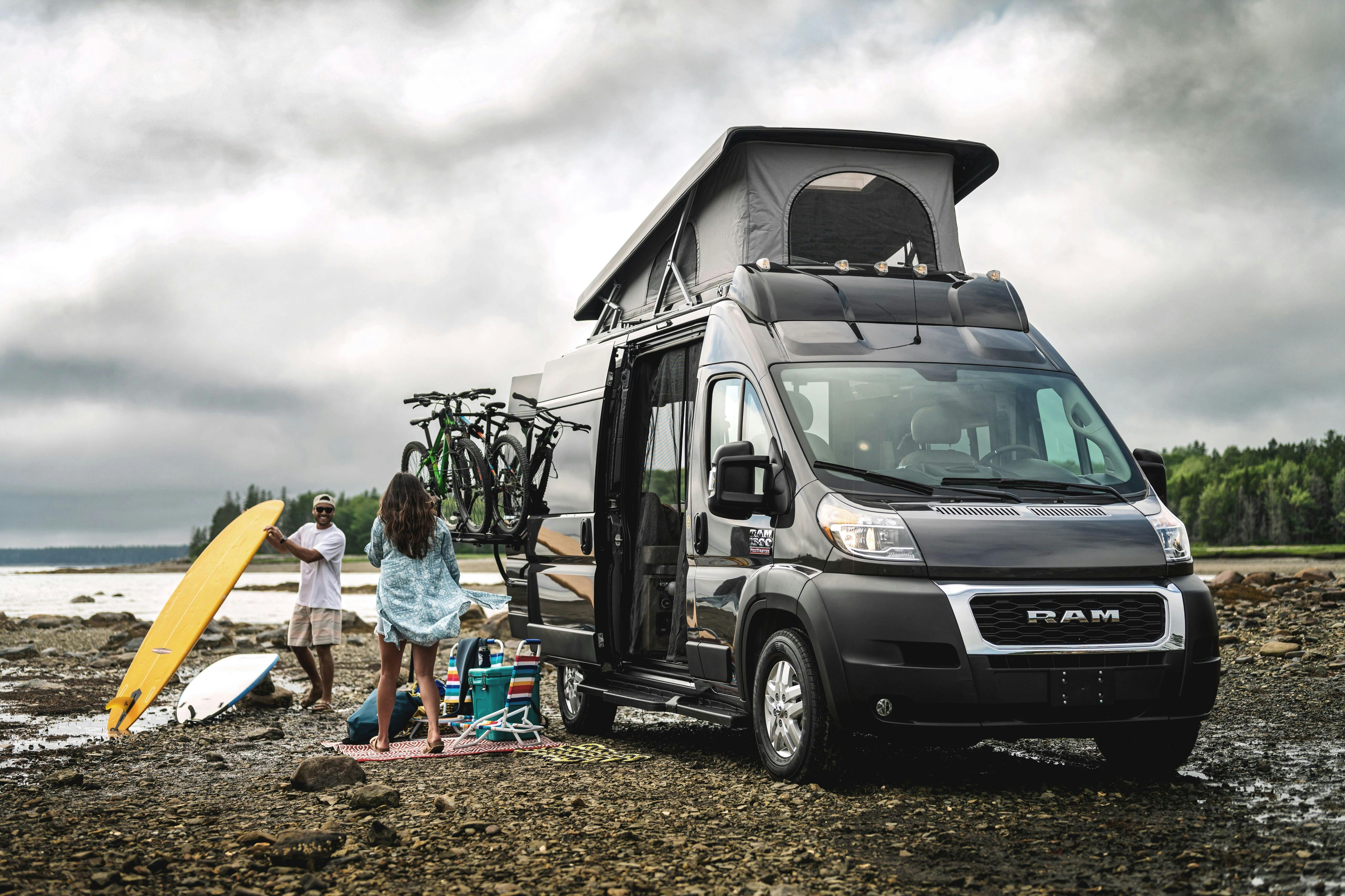 A couplet sets up camp outside of a Thor Motor Coach Scope Class B Camper Van