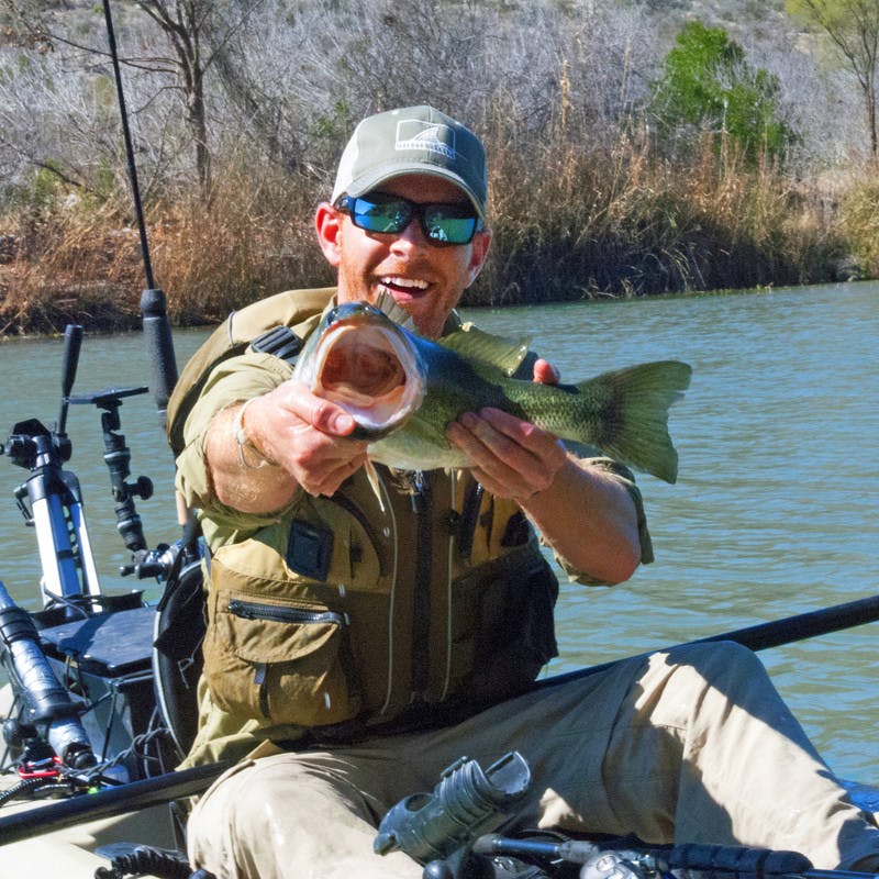 Showing off a bass pulled out of Devils River.