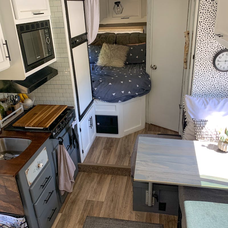 A view of the kitchen, dinette and back bedroom in Jason and Dawn's Class C RV.