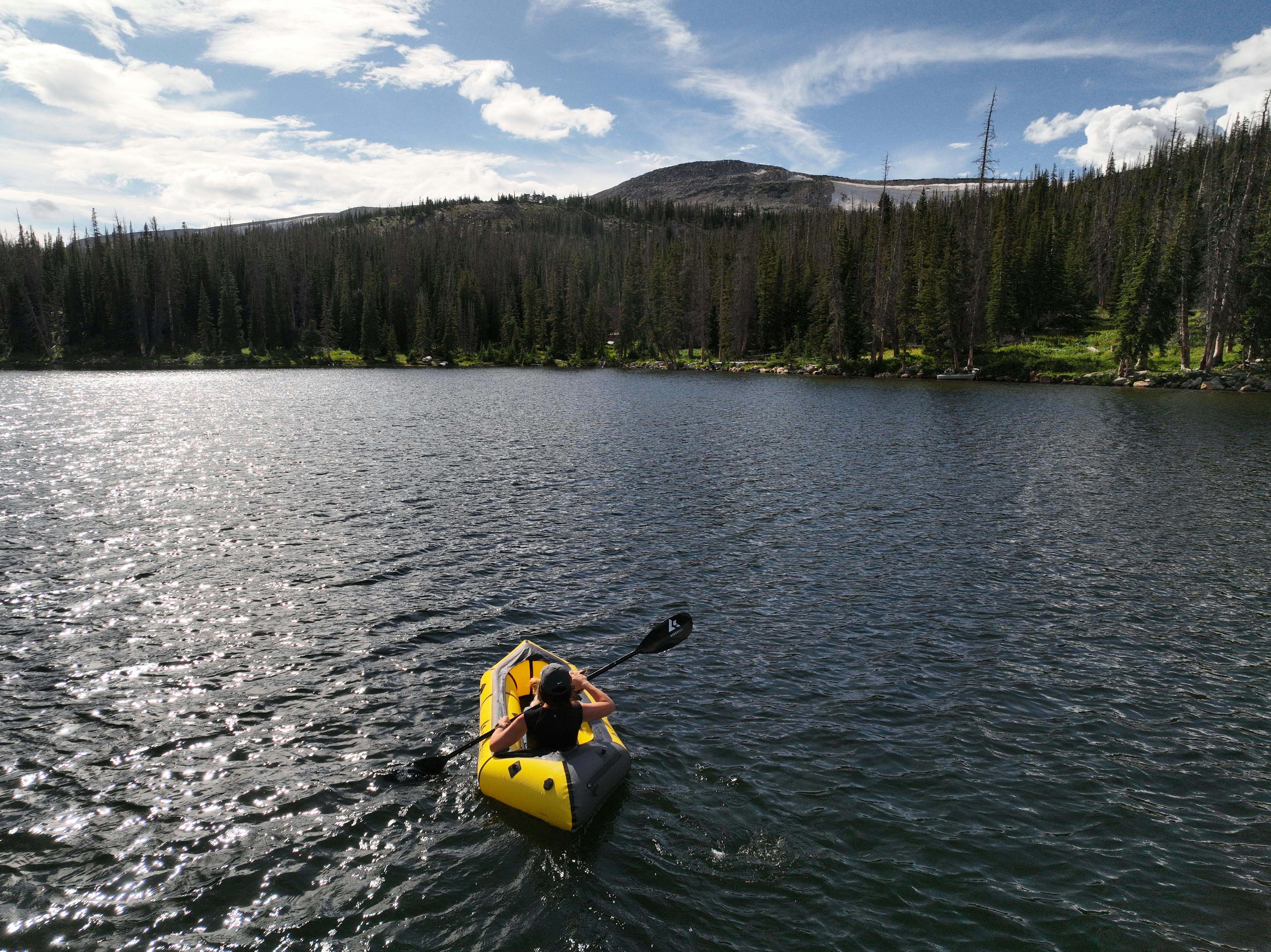 Sarah Bauer packrafting in Brooklyn Lake in Medicine Bow Routt National Forest